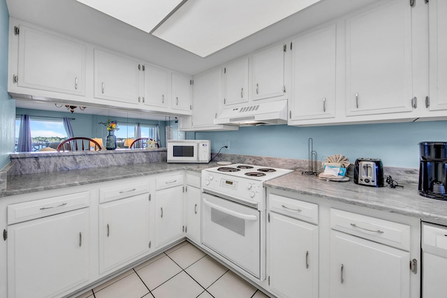 909 Santa Rosa Blvd Unit 561, Fort Walton Beach, FL 32548 - kitchen featuring white appliances, white cabinetry, and custom exhaust hood