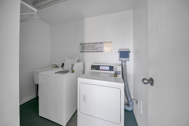 909 Santa Rosa Blvd Unit 561, Fort Walton Beach, FL 32548 - washroom featuring dark colored carpet and separate washer and dryer