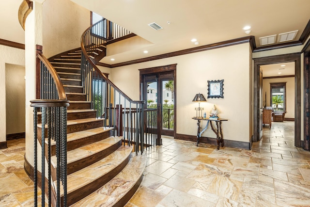 stairway featuring ornamental molding, baseboards, and stone tile flooring