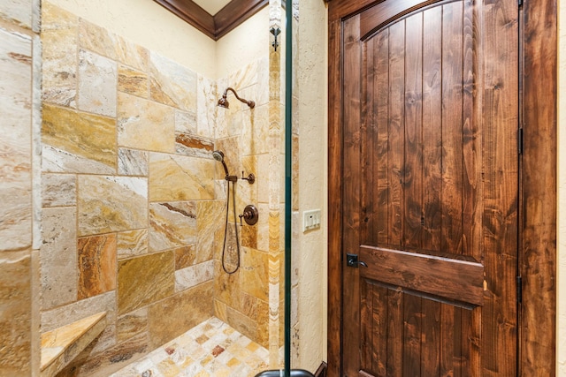 bathroom with tiled shower