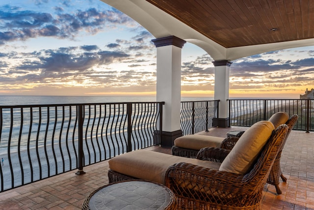 balcony at dusk with a water view