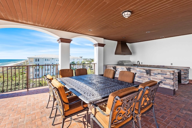 view of patio with outdoor dining area, area for grilling, and grilling area