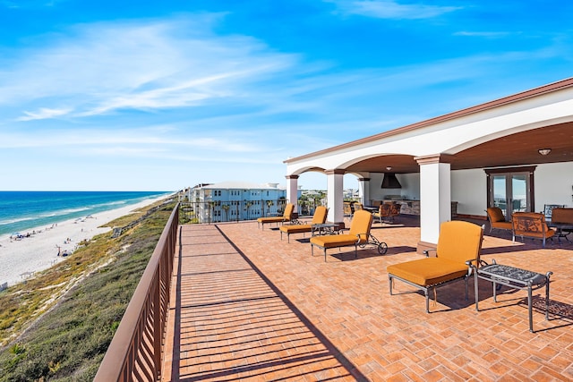 view of community with a view of the beach and a water view