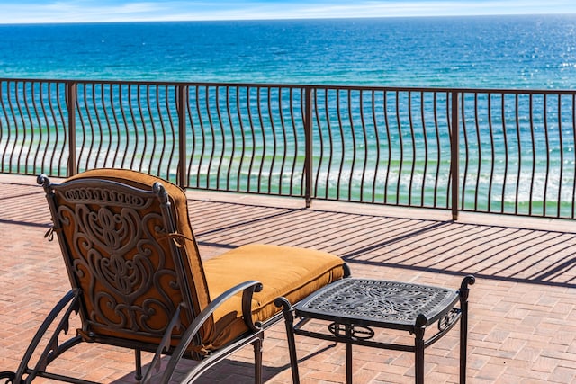 balcony featuring a water view