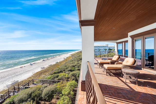 exterior space with a beach view and a water view