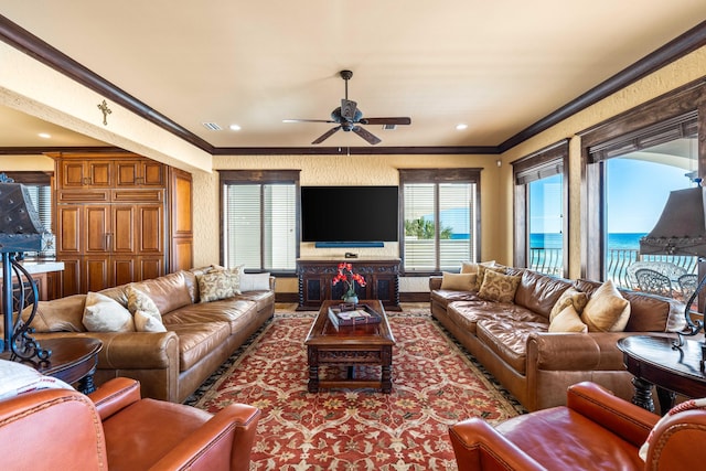 living room with visible vents, wallpapered walls, crown molding, ceiling fan, and recessed lighting