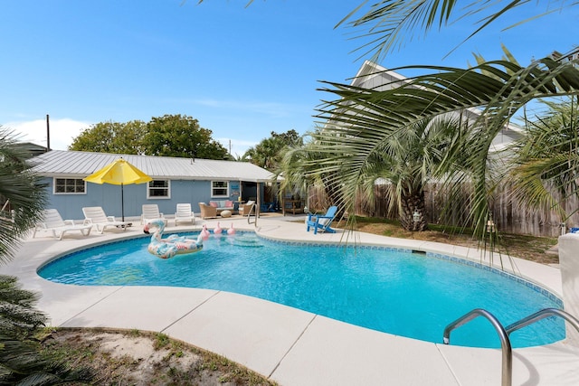 view of pool with a patio area and an outdoor living space