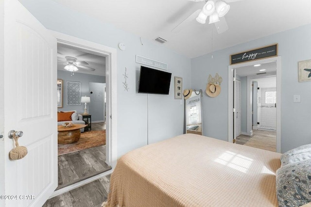 bedroom featuring hardwood / wood-style floors and ceiling fan