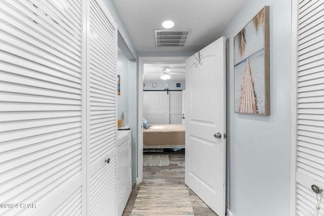 hallway featuring hardwood / wood-style floors