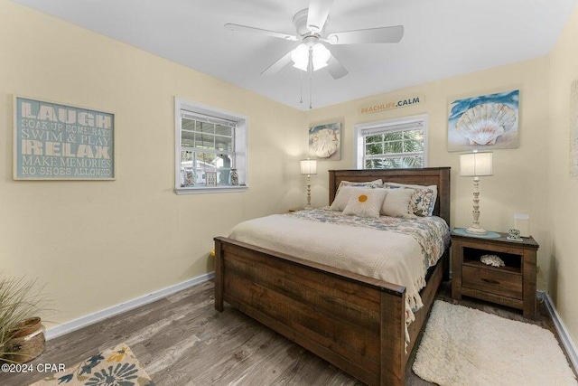 bedroom featuring wood-type flooring and ceiling fan