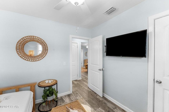 bedroom featuring wood-type flooring and ceiling fan