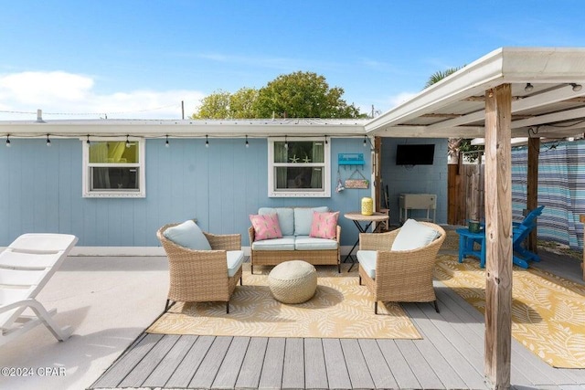 wooden deck with an outdoor hangout area