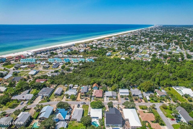 birds eye view of property featuring a water view and a view of the beach