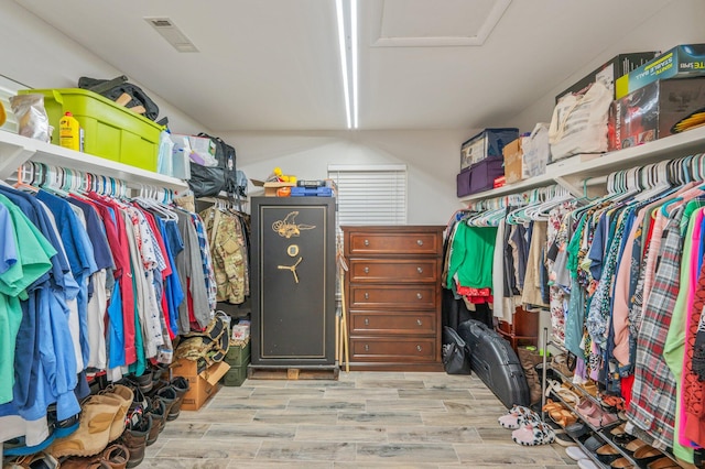 walk in closet featuring light hardwood / wood-style floors