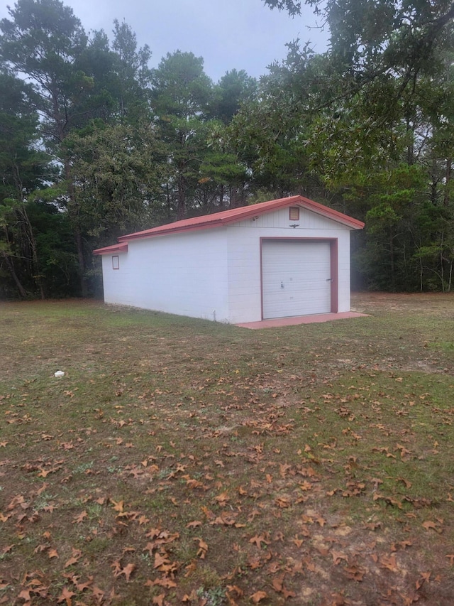 garage with a yard