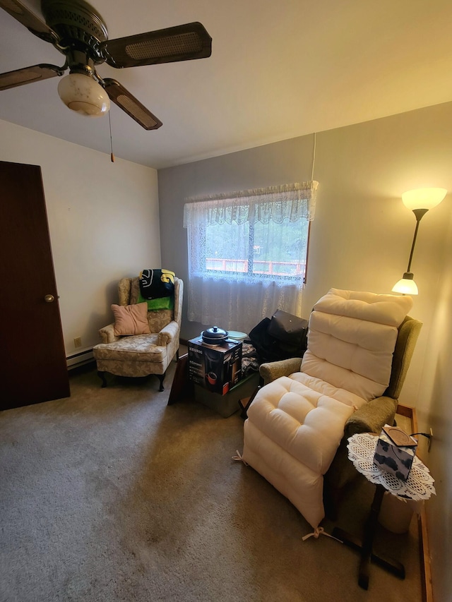 living area with dark colored carpet, ceiling fan, and a baseboard radiator