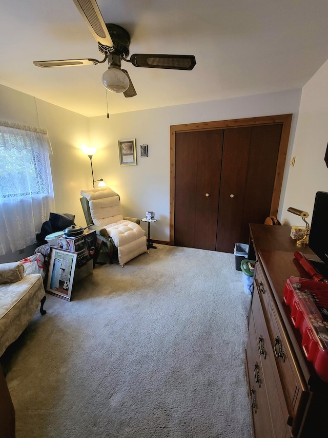 sitting room featuring carpet floors and ceiling fan