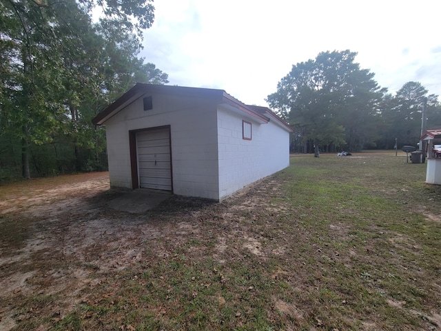 garage with a lawn