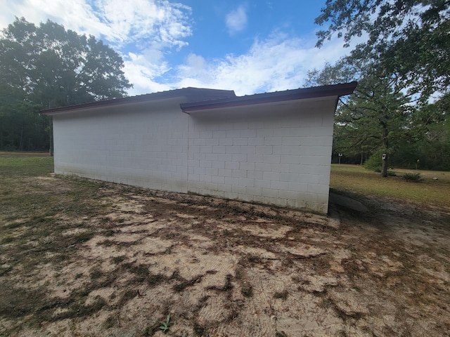 114 W May Lilly Ct, Defuniak Springs, FL 32433 - view of side of home featuring concrete block siding