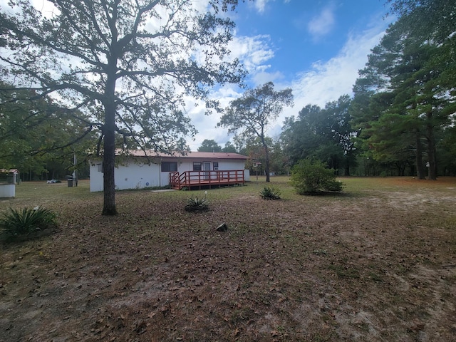 view of yard with a deck