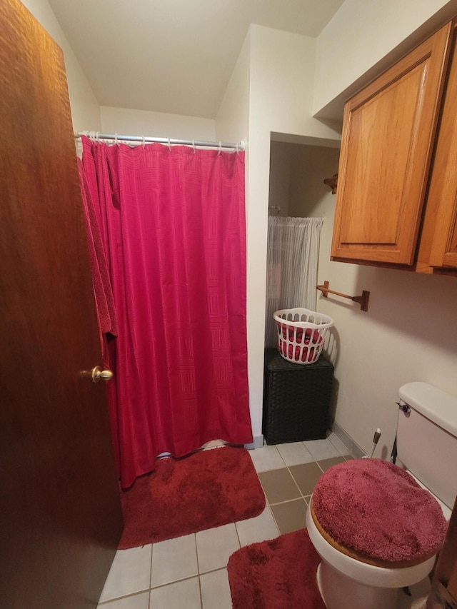 114 W May Lilly Ct, Defuniak Springs, FL 32433 - bathroom with tile patterned flooring, toilet, and curtained shower