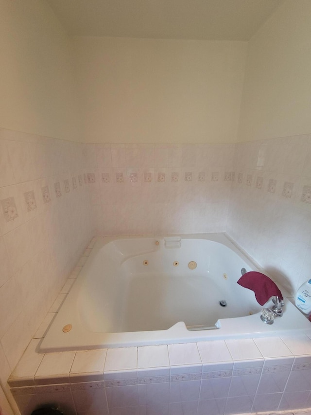 bathroom with tiled tub