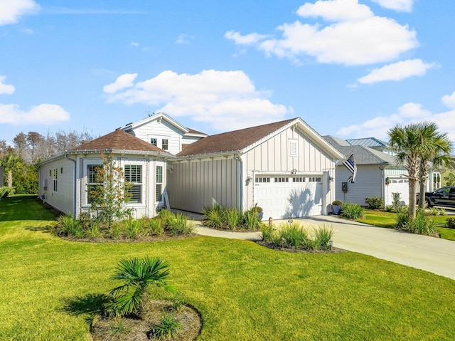 view of front of house with a garage and a front lawn