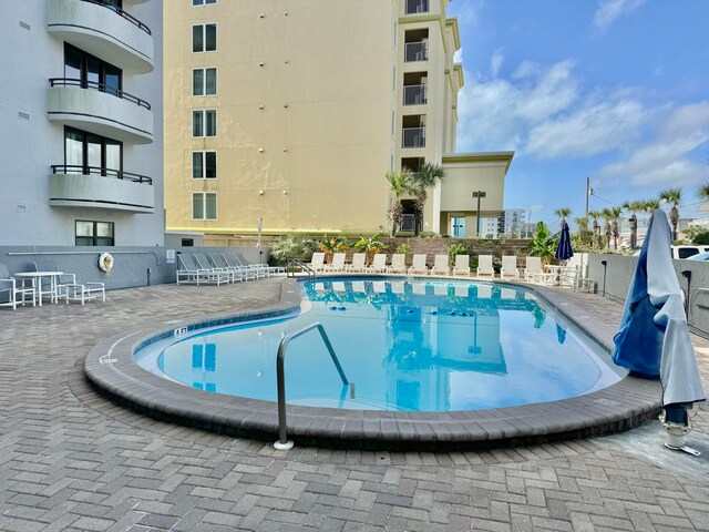 view of pool featuring a patio