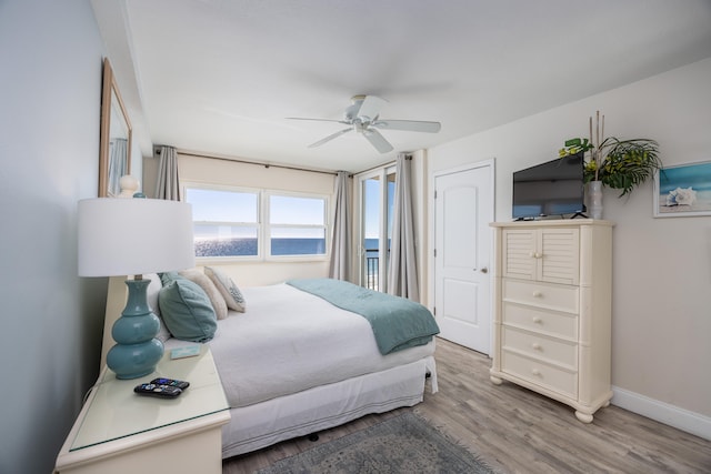 bedroom with hardwood / wood-style flooring and ceiling fan