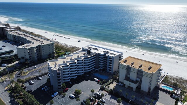 bird's eye view featuring a water view and a view of the beach