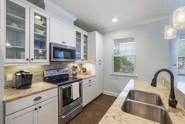 kitchen featuring pendant lighting, sink, appliances with stainless steel finishes, and plenty of natural light