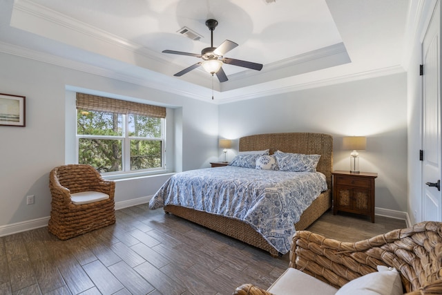 bedroom featuring ornamental molding, ceiling fan, a raised ceiling, and dark hardwood / wood-style floors