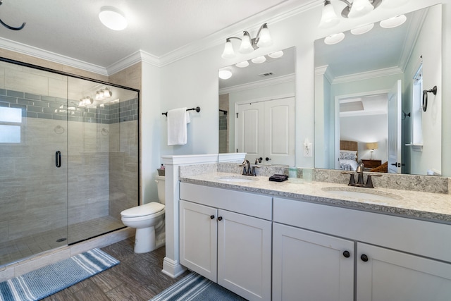 bathroom featuring an enclosed shower, toilet, hardwood / wood-style flooring, and crown molding