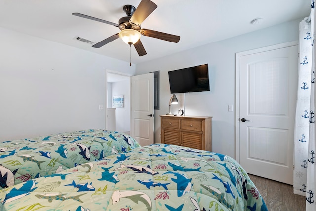 bedroom with ceiling fan and light wood-type flooring