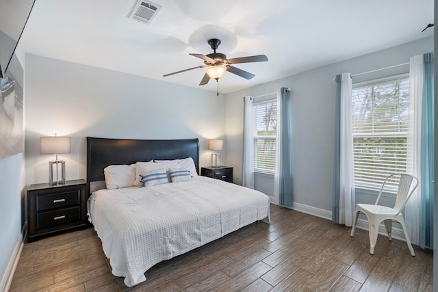 bedroom featuring ceiling fan and dark wood-type flooring