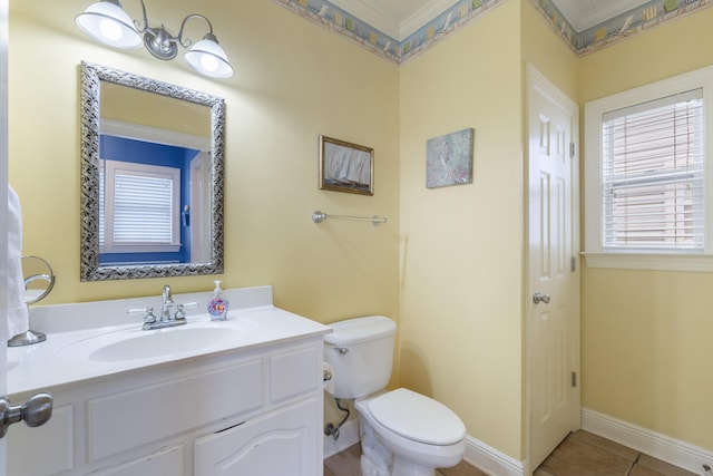 bathroom with tile patterned floors, vanity, ornamental molding, and toilet