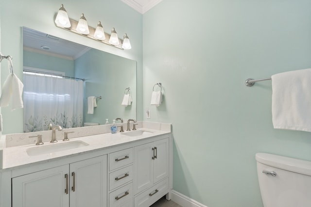 bathroom with vanity, toilet, curtained shower, and crown molding