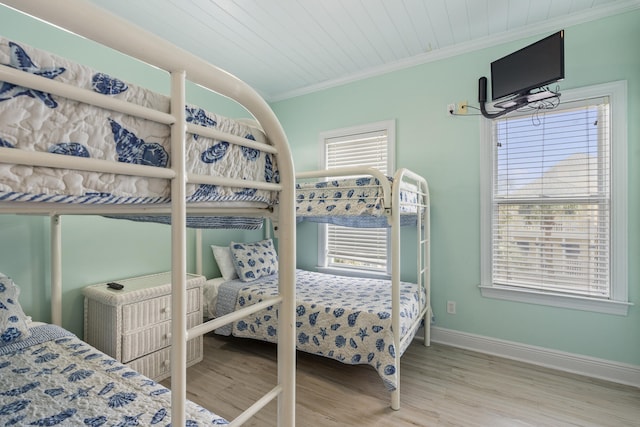 195 Emerald Dunes Cir, Santa Rosa Beach, FL 32459 - bedroom featuring ornamental molding, multiple windows, and wood finished floors