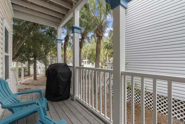 wooden deck featuring area for grilling