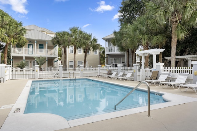 view of swimming pool with a patio