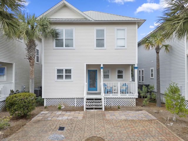 back of property with a patio area, a porch, and central AC unit