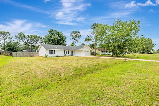 ranch-style house featuring a garage and driveway