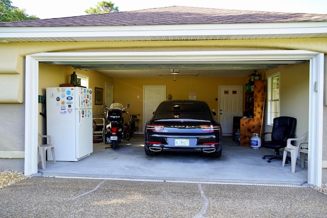 garage featuring white fridge