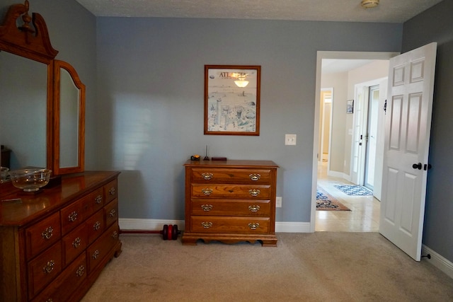 carpeted bedroom with a textured ceiling