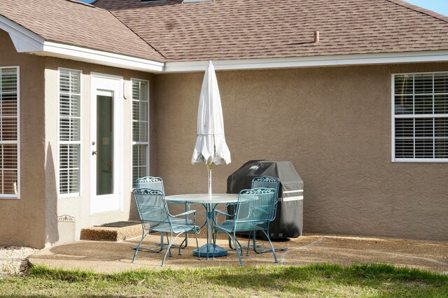 view of patio featuring a grill