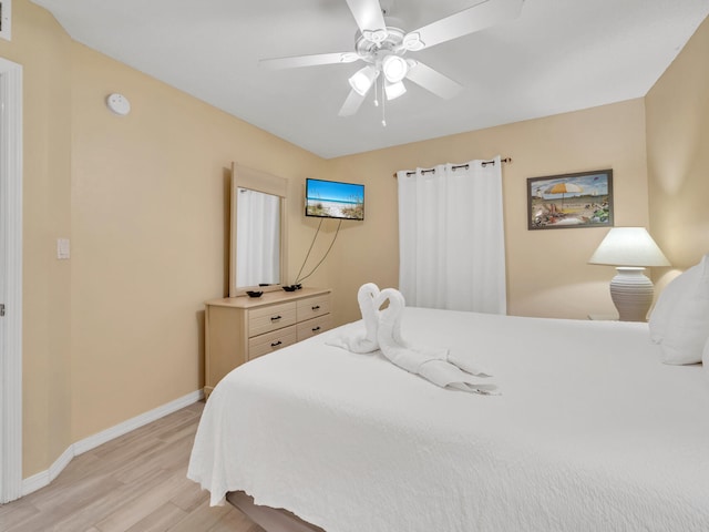 bedroom featuring light wood-type flooring and ceiling fan