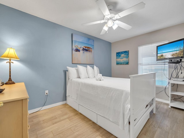 bedroom featuring ceiling fan and light hardwood / wood-style floors