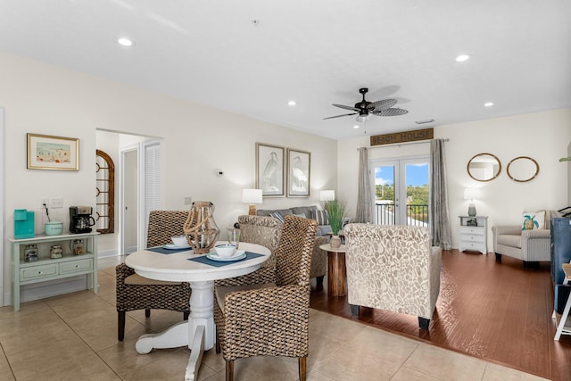 dining room with ceiling fan, french doors, and light hardwood / wood-style floors