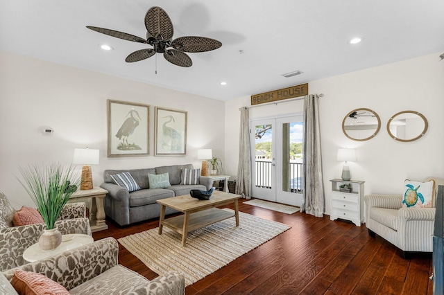 living room featuring dark hardwood / wood-style flooring, french doors, and ceiling fan