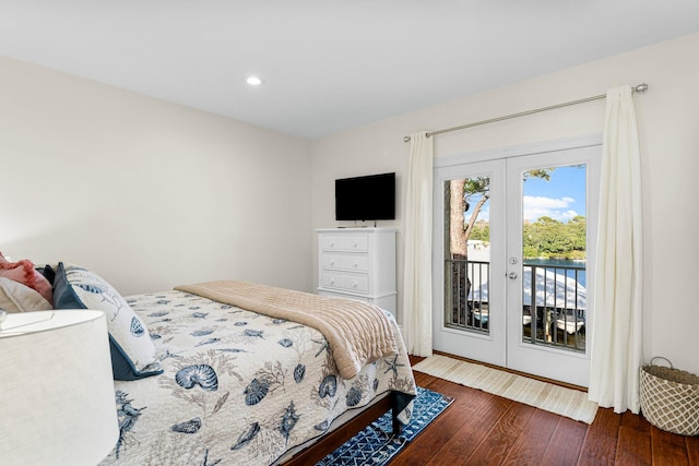 bedroom with dark hardwood / wood-style flooring, french doors, and access to outside